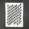 Betsy Marie's veggie printed tea towel with a graphic pattern made from printing beets