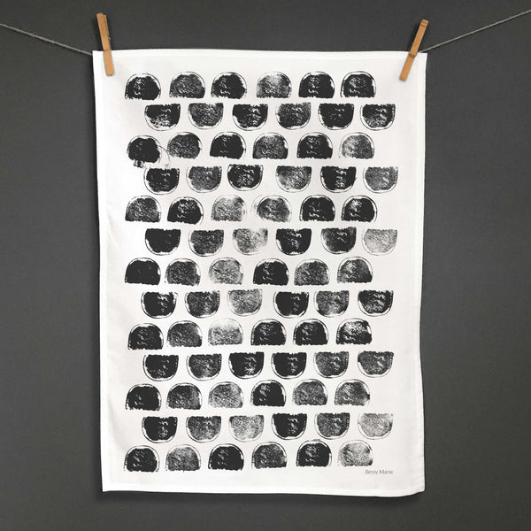 Betsy Marie's veggie printed tea towel with a graphic pattern made from printing sweet potatoes