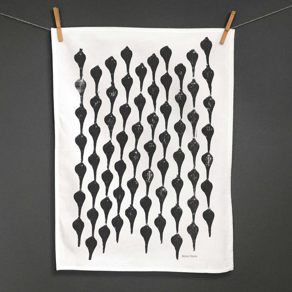 Betsy Marie's veggie printed tea towel with a graphic pattern made from printing beets