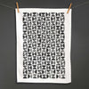 Betsy Marie's veggie printed tea towel with a graphic pattern made from printing radishes
