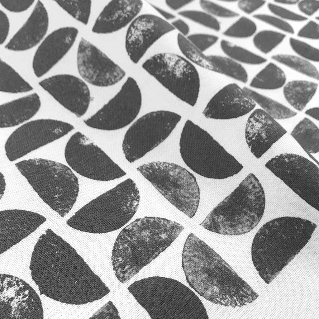 Detail of Betsy Marie's veggie printed tea towel with a graphic pattern made from printing radishes